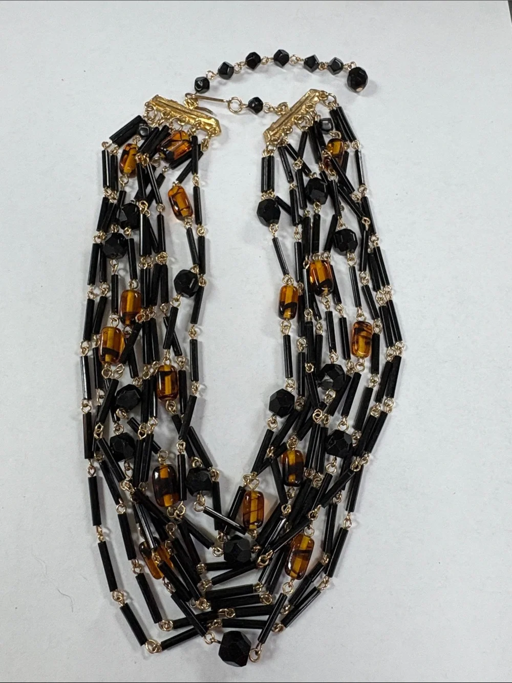 Gold-Accented Black and Amber Multi-Strand Necklace